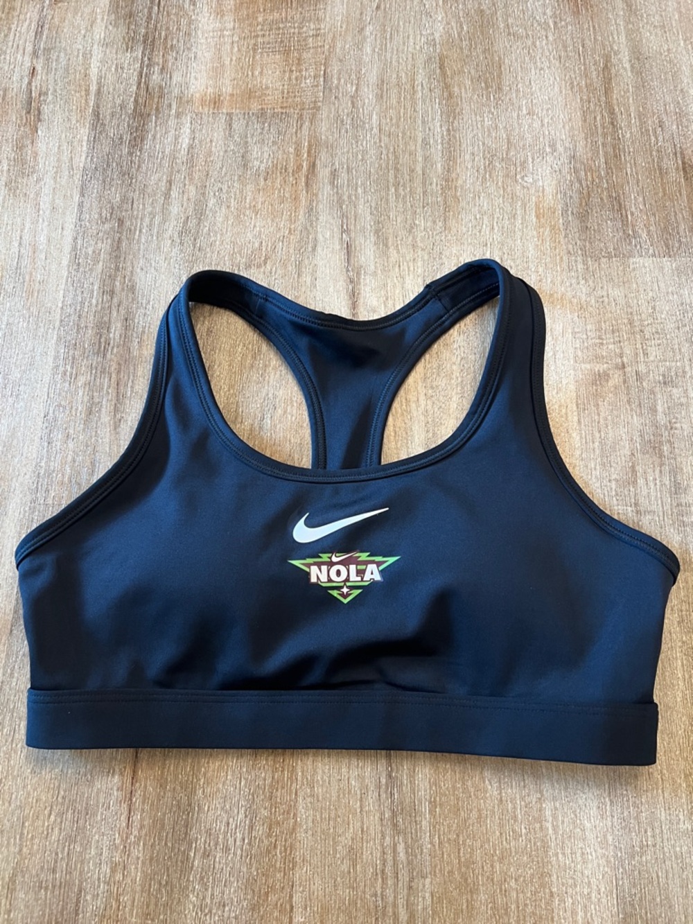 Nike Black Racerback Sports Bra with White Swoosh and Green NOLA Accent